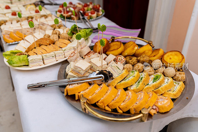 Beautiful Various delicious canapés served in a plate on the table